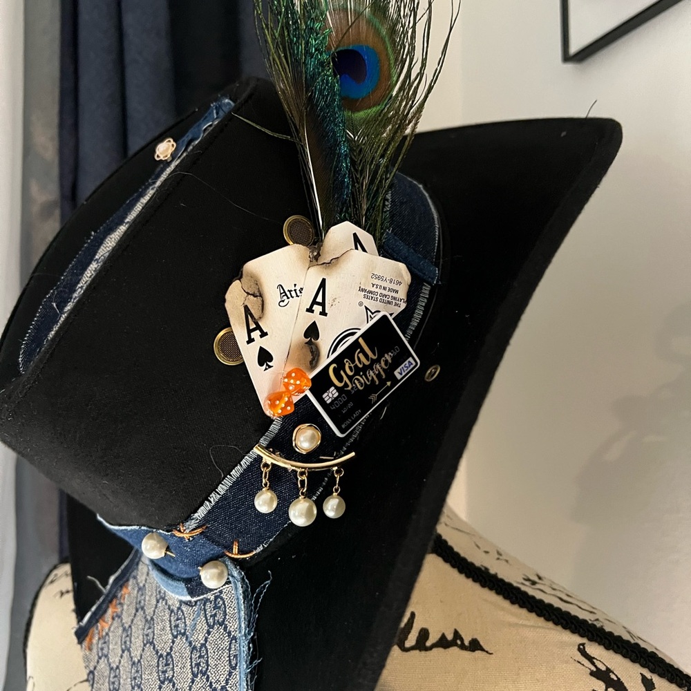 Elegant Black and Blue Feathered Hat with Playing Card Detail